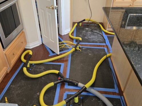 Hardwood Floor Drying System in Active Operation - DriForce Property Restoration, Birmingham, MI