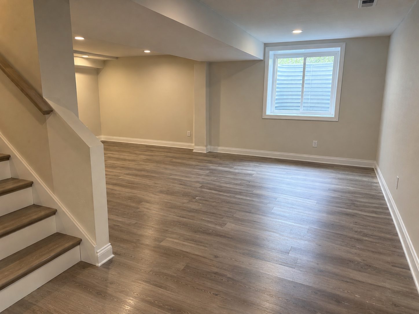 Finished lower level restored after storm-related water damage in a Michigan home