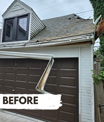 Garage with wind-damaged roof and fallen gutter - before storm damage repair by DriForce