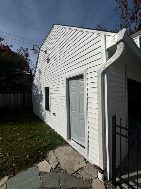 Michigan home fully restored with new roof, siding and gutters after storm damage