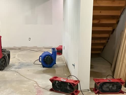 Air movers drying a Metro Detroit basement after a water loss - DriForce Property Restoration